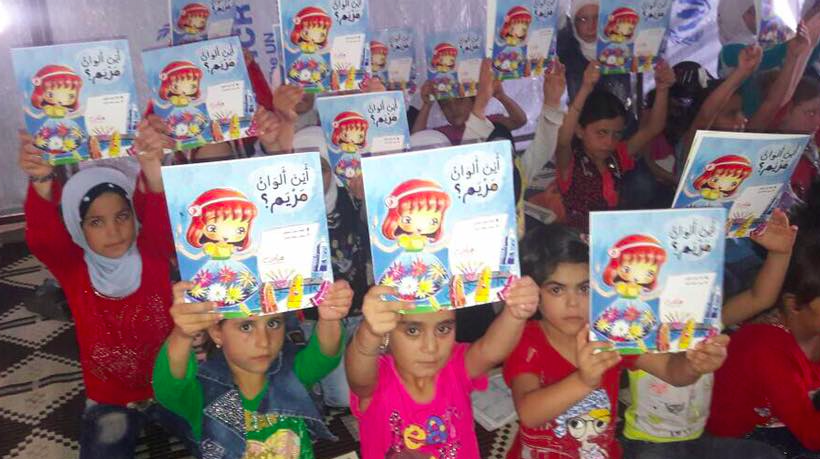 Children in Syria with books received from Project Peace